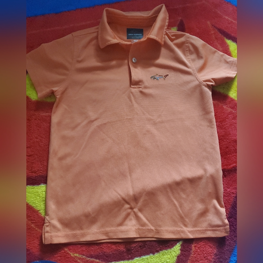 Greg Norman orange polo shirt size 6-7 worn only once in excellent condition